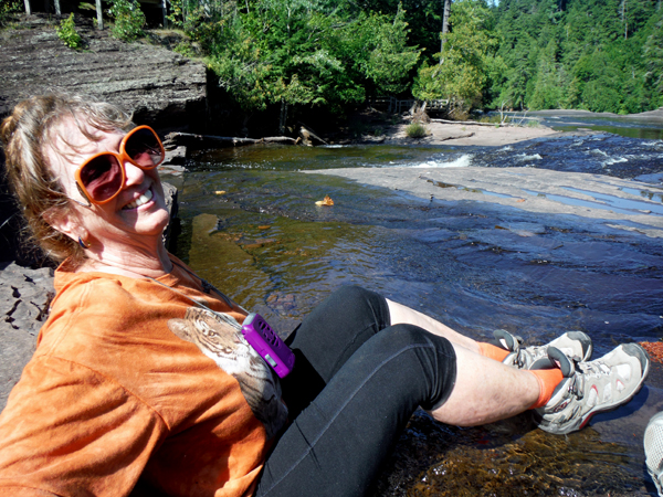 Karen Duquette resting in the waters of Manido Falls